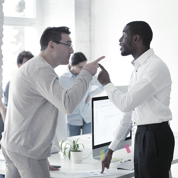 Men in an office fighting